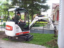 Bobcat Removing Grass